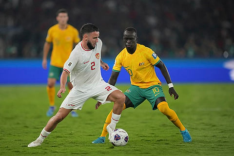 2026 FIFA World Cup Qualifying, Indonesia Australia: Indonesia's Calvin Verdonk, left, battles for the ball against Australia's Awer Mabil 